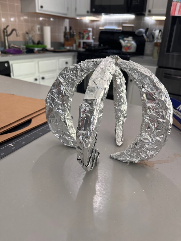 claw made from cardboard and tin foil