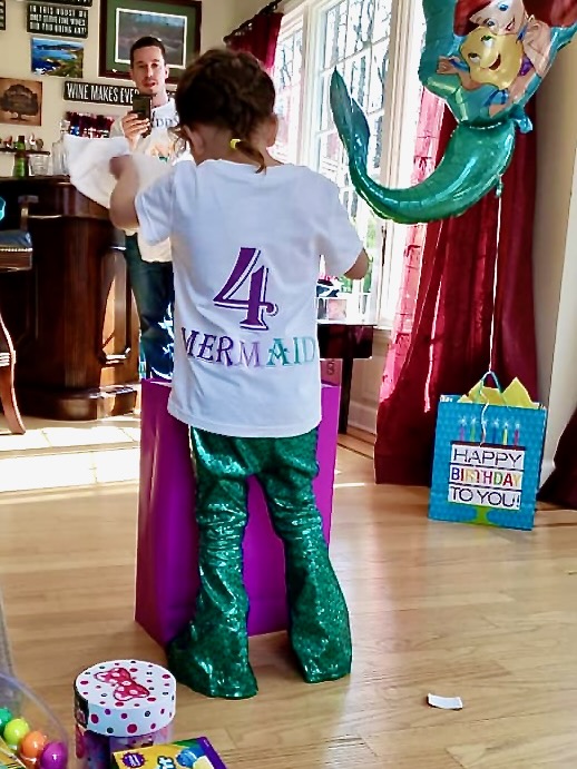 little girl with 4 tee shirt and mermaid pants