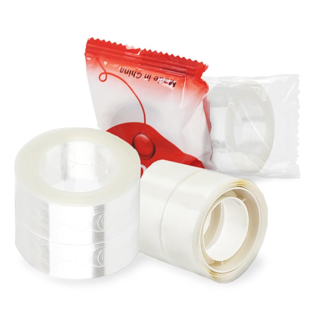 Clear balloon glue dots and adhesive rolls used for DIY party decorations and balloon garlands