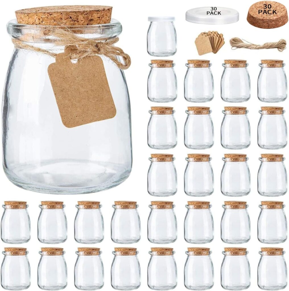 Mini glass favor jars with cork lids, twine, and tags for DIY honey baby shower favors